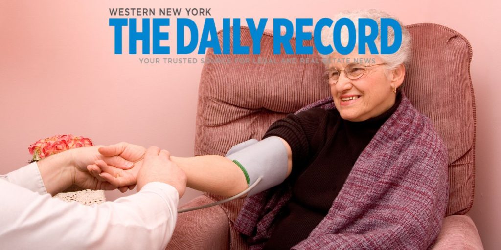 elderly woman being cared for at home with daily record logo